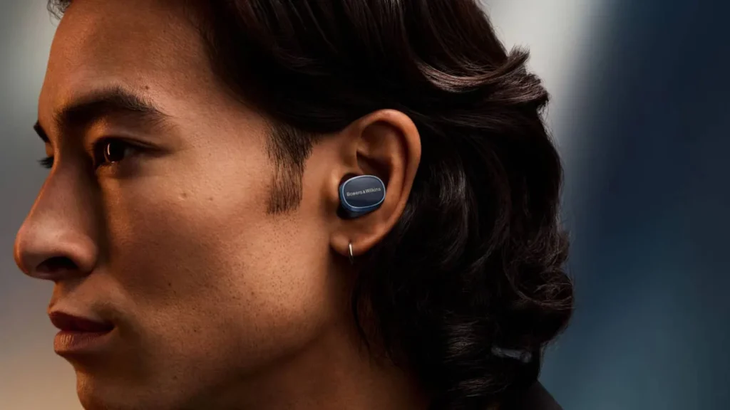 man wearing Bowers & Wilkins Pi8 in style